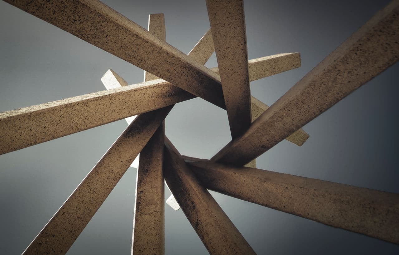 Interlocking bronze beams converging to a single centre